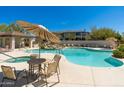 Community pool with hot tub, seating and covered outdoor kitchen area at 33550 N Dove Lakes Dr # 1041, Cave Creek, AZ 85331