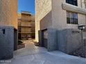 Exterior view of a condo building featuring multiple levels, balconies, and desert landscaping at 5132 N 31St Way # 123, Phoenix, AZ 85016