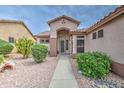Inviting home with a landscaped yard, desert-friendly plants, and neutral colors at 5289 S Red Yucca Ln, Gold Canyon, AZ 85118
