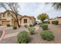 Charming single-Gathering home with desert landscaping, gravel, and a paved walkway to the front door at 5415 E Mckellips Rd # 104, Mesa, AZ 85215