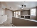 Bright and airy living room featuring a ceiling fan, a built-in niche, and sliding glass doors at 5415 E Mckellips Rd # 104, Mesa, AZ 85215