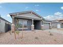 Charming single-Gathering home showcasing a gray exterior with desert landscaping at 11432 E Utopia Ave, Mesa, AZ 85212