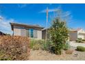 A charming single-story home featuring desert landscaping at 11574 W Levi Dr, Avondale, AZ 85323