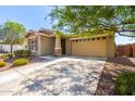 Attractive home exterior showcasing a spacious driveway and a well-maintained front yard with desert landscaping at 2831 W Carson Rd, Phoenix, AZ 85041