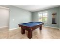 Game room featuring a pool table, neutral paint and light tile flooring at 2831 W Carson Rd, Phoenix, AZ 85041