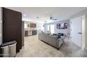 Open living area featuring tile floors, modern decor, and a view of the kitchen at 2912 E Eberle Ln, Phoenix, AZ 85032