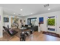 Bright living room with modern furnishings, hardwood floors, and large windows at 3117 E Campbell Ave, Phoenix, AZ 85016