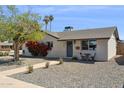 Beautiful single-story home with desert landscaping, a brick facade, and a charming front entrance at 3405 S Cutler Dr, Tempe, AZ 85282