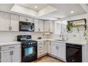 Bright kitchen featuring white cabinets, quartz countertops, and stainless steel appliances at 3405 S Cutler Dr, Tempe, AZ 85282
