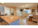 Spacious kitchen with custom island and wood table, offering great prep and dining space at 4238 W Krall St, Phoenix, AZ 85019