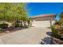 Charming single-story home with a well-kept front lawn and a spacious two-car garage at 45140 W Zion Rd, Maricopa, AZ 85139