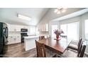 Bright kitchen with white cabinets, modern appliances, and adjacent dining area, perfect for gatherings at 843 W Palo Verde St, Gilbert, AZ 85233