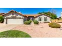 Charming single-story home features a desert-landscaped front yard and an attached two-car garage at 930 E Citation Ln, Tempe, AZ 85284