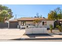 Charming single-story home with a desert-landscaped front yard and modern mailbox at 7030 N 12Th St, Phoenix, AZ 85020