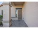A welcoming covered front porch with a security door and attractive facade at 11835 W Windsor Ave, Avondale, AZ 85392