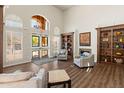Bright lobby featuring wood floors, a fireplace, and built-in bookshelves at 14575 W Mountain View Blvd # 10313, Surprise, AZ 85374