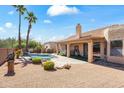 Private backyard oasis with a sparkling pool, mature palms, and comfortable patio space at 14655 N Kings Way, Fountain Hills, AZ 85268