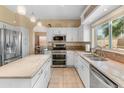 Stylish kitchen featuring an island, stainless appliances, and granite countertops at 15055 S 40Th Pl, Phoenix, AZ 85044