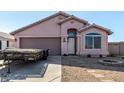 Inviting single-story home with a well-manicured lawn, two car garage, and desert landscaping at 16150 N 86Th Ave, Peoria, AZ 85382