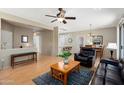 Open-concept living area showcasing wood floors and seamless transitions to the dining and kitchen spaces at 16160 W Starlight Dr, Surprise, AZ 85374