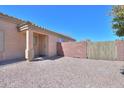 A private backyard space with a brick wall and gravel ground cover is perfect for outdoor living at 1778 E Bishop Pl, Casa Grande, AZ 85122
