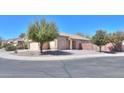 A tan single-story home features desert landscaping and a well-kept yard in a quiet neighborhood at 1778 E Bishop Pl, Casa Grande, AZ 85122