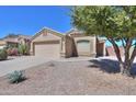 Attractive home with desert landscaping, two-car garage, and a welcoming entrance in a sunny locale at 1778 E Bishop Pl, Casa Grande, AZ 85122