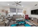Inviting living room featuring comfortable seating, modern ceiling fan, and bright, neutral decor at 17850 N 68Th St # 1037, Phoenix, AZ 85054