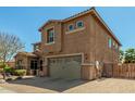 Beautiful two-story home with a spacious driveway and a two-car garage at 18483 W Paradise Ln, Surprise, AZ 85388