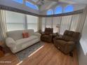 Bright sunroom with high ceilings, neutral furniture and lots of light at 2072 W Klamath Ave, Apache Junction, AZ 85119