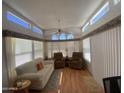 Inviting living room with clerestory windows, ceiling fan and comfortable seating at 2072 W Klamath Ave, Apache Junction, AZ 85119