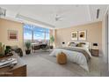Bright bedroom with a large window, a desk, and a comfortable seating area at 2211 E Camelback Rd # 604, Phoenix, AZ 85016