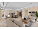 Open-concept living and dining area featuring modern furnishings and ample natural light at 2211 E Camelback Rd # 604, Phoenix, AZ 85016