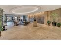 Grand lobby adorned with modern lighting, comfortable seating, and artistic waterfall design at 2211 E Camelback Rd # 604, Phoenix, AZ 85016