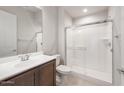 Bathroom featuring a glass-enclosed shower, single vanity and tile flooring at 26942 W Renee Dr, Buckeye, AZ 85396