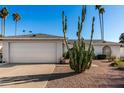 Charming single-story home featuring desert landscaping, a two-car garage, and a well-maintained facade at 2717 W Medina Ave, Mesa, AZ 85202