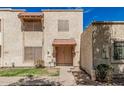 Charming townhome with a traditional desert landscape and cozy front patio at 3113 W Royal Palm Rd, Phoenix, AZ 85051