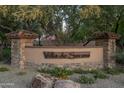 Attractive Villa de Sorano community sign with stone accents and lush greenery at 5641 E Grovers Ave, Scottsdale, AZ 85254