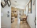 Inviting living room featuring tile floors, neutral tones, and comfortable seating at 7329 W Lamar Rd, Glendale, AZ 85303