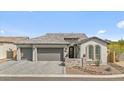 Beautiful home featuring a spacious three-car garage and professionally landscaped front yard with great curb appeal at 8154 E Jaeger St, Mesa, AZ 85207