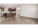 Open-concept kitchen with sleek cabinets, island, and stainless steel appliances at 9431 E Coralbell Ave # 178, Mesa, AZ 85208