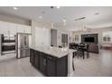 Open concept kitchen featuring stainless steel appliances, granite countertops, and an island at 19011 E Carriage Way, Queen Creek, AZ 85142