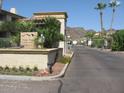 Pointe Resort Condominiums entrance with desert landscaping, gate and mountain views at 10410 N Cave Creek Rd # 1011, Phoenix, AZ 85020