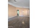 Open-concept living room with tile flooring, neutral walls, and recessed lighting at 11363 W Locust Ln, Avondale, AZ 85323