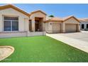 Charming single-Gathering home with a two-car garage and well-manicured lawn at 1347 W Straford Ave, Gilbert, AZ 85233