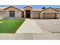 Inviting single-Gathering home with a front lawn and spacious driveway at 1347 W Straford Ave, Gilbert, AZ 85233