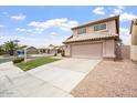 Charming two-story home showcasing a well-manicured lawn, a neutral palette, and a spacious two-car garage at 1520 E Flint St, Chandler, AZ 85225