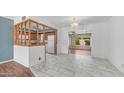 Open concept dining room featuring tile floors, and a view of the kitchen at 6258 E Duncan St, Mesa, AZ 85205