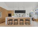 Bright kitchen features marble countertops, modern cabinetry, and an island with seating at 7624 E Larkspur Dr, Scottsdale, AZ 85260