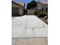 Long concrete driveway leads to a gated entrance at , Gilbert, AZ 85233